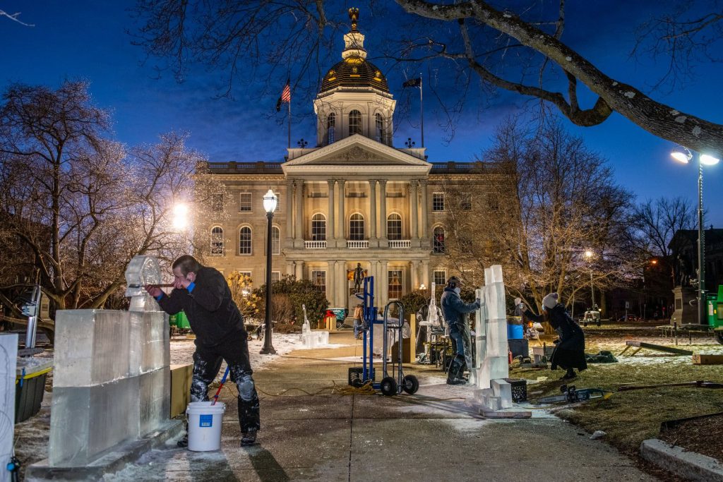 Ice carvers take place in the competition in front of the State House at a previous Winter Fest downtown.