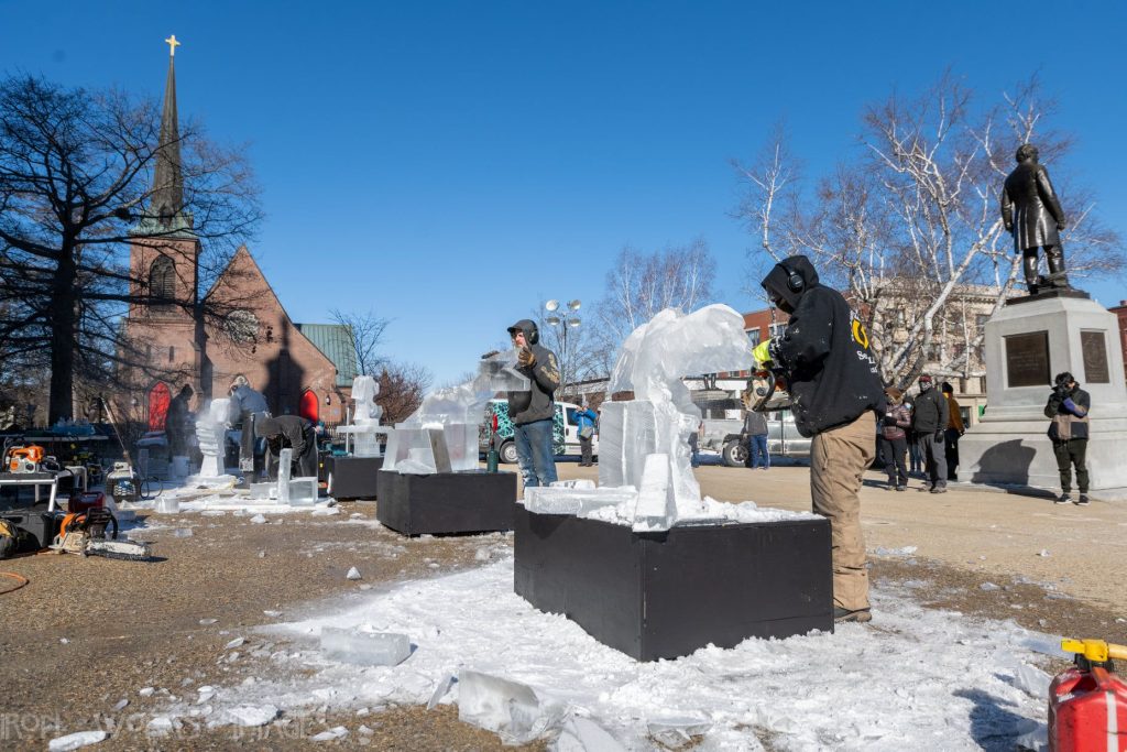 Ice carvers take place in the competition in front of the State House at a previous Winter Fest downtown.