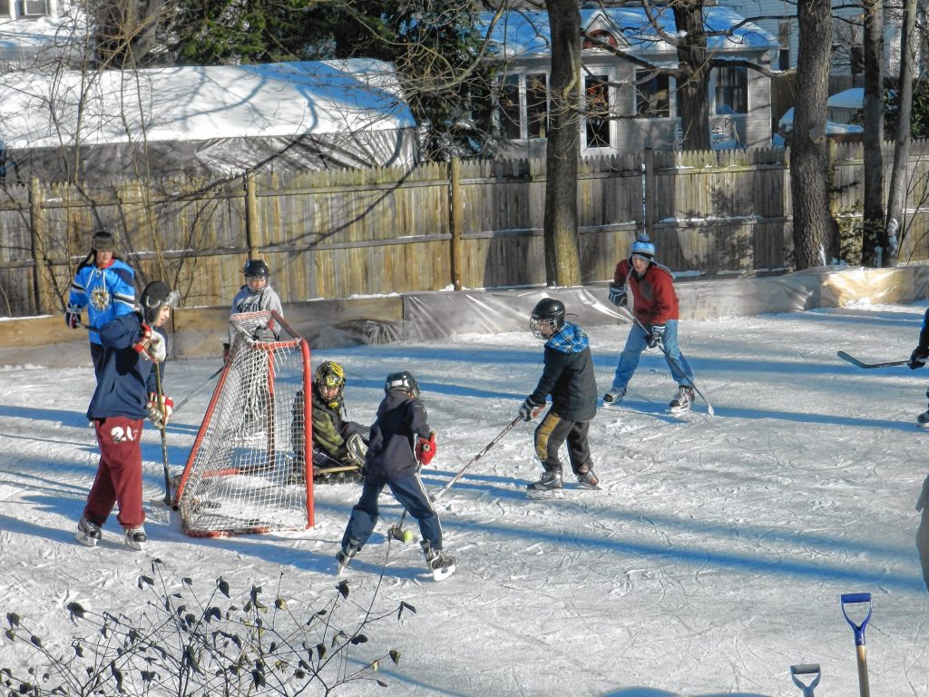 Kids play on the outdoor hockey rink at the Philbrick house. Oct. 23, 2023. 