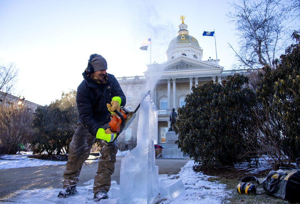 Alex Bienieck of Wentworth works on his ice sculpture of the âOld Man on the Mountainâ on the State House lawn during the ice sculpture competition during the 2021 Winter Fest on Friday, January 29, 2021. The downtown event continues today with  Ice Carving Competition Award Ceremony, Winter Shopping Stroll at Concordâs restaurants and stores, Intown Concord Activities offering hot cocoa, hot cider, and snacks. GEOFF FORESTER