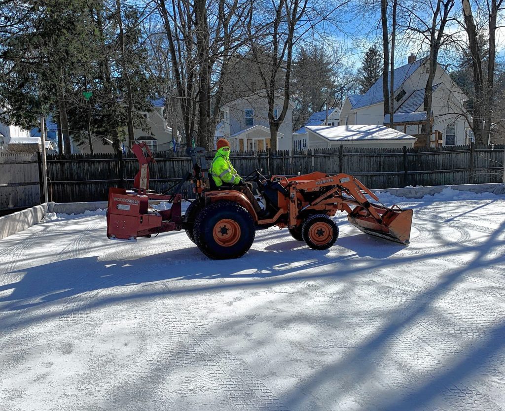 A tractor clears the ice on the Philbrick's outdoor hockey rink. Oct. 23, 2023. 